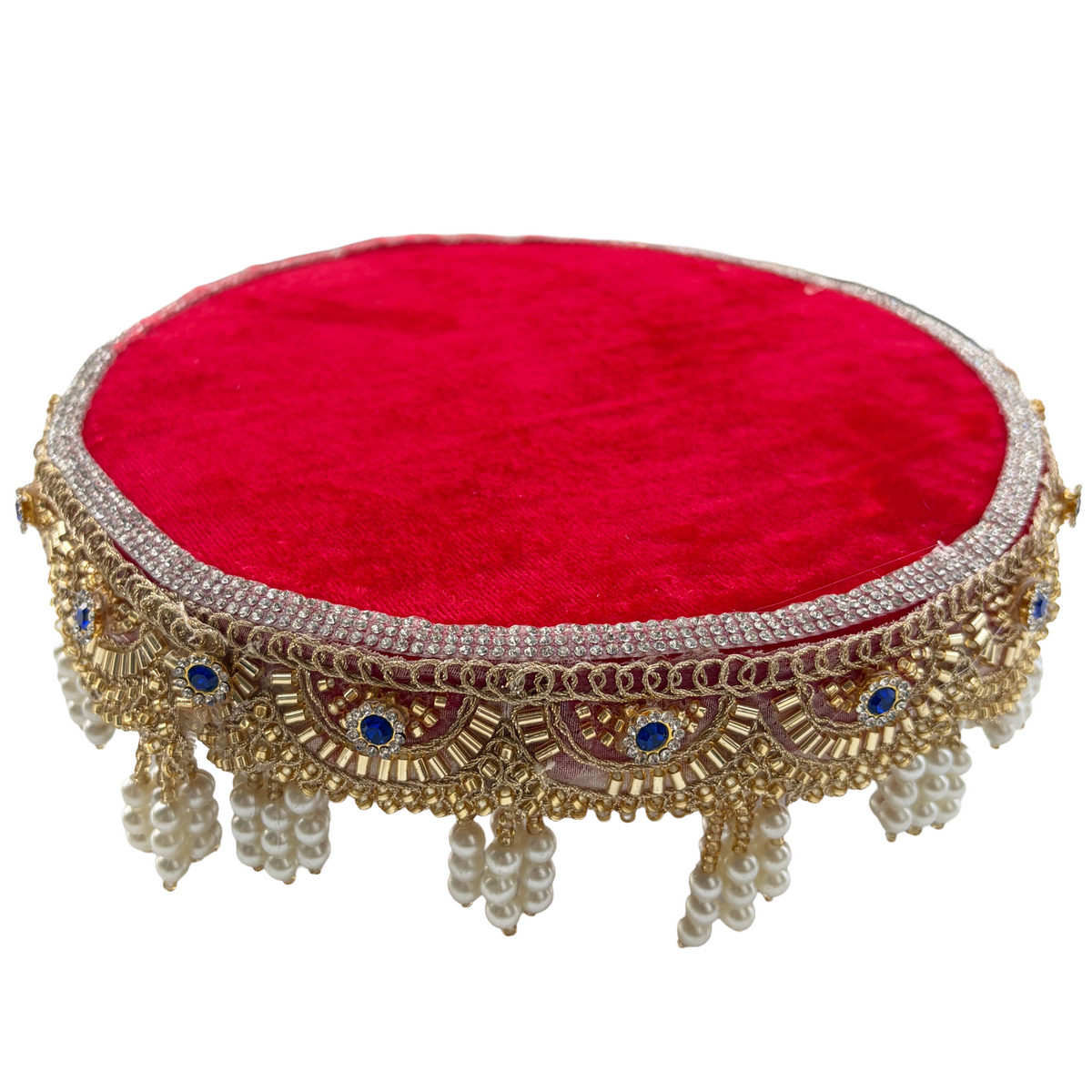 Decorative red cushion with gold embroidery on a white background